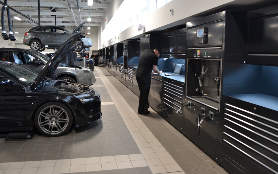 Engineer working in Audi Farnborough workshop with garage equipment installation by CCS Garage Equipment