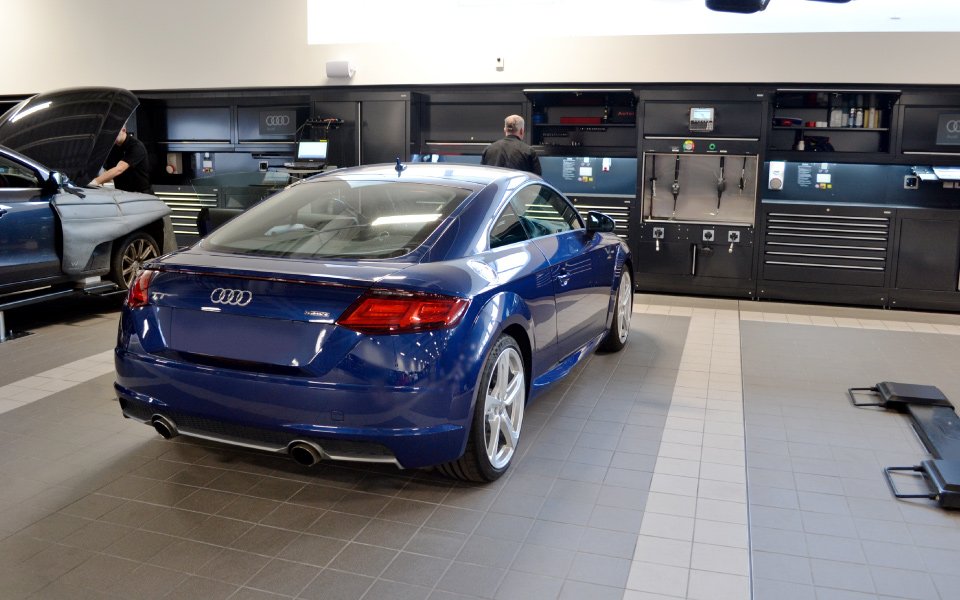 Vehicles in maintenance workshop at Audi Farnborough car dealership