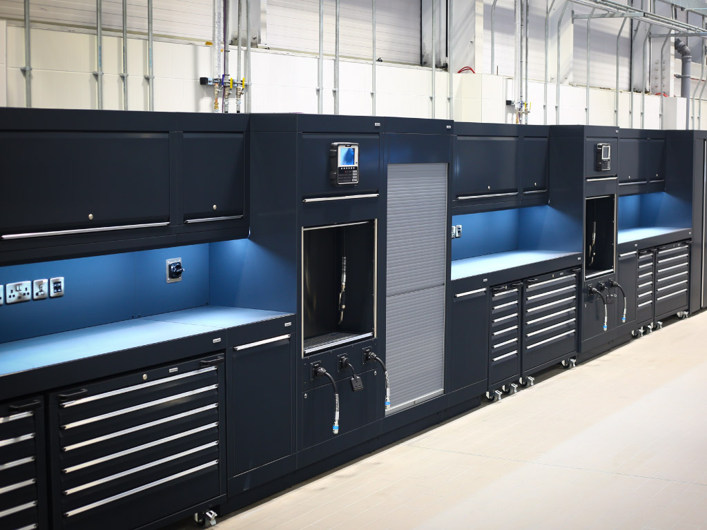 Eye-catching, fully-integrated Dura workshop furniture featuring compressed air, vehicle charging point, power & connectivity to meet BMW Mini car dealership workshop’s brand specification, installed by CCS Garage Equipment in Crewe, Cheshire