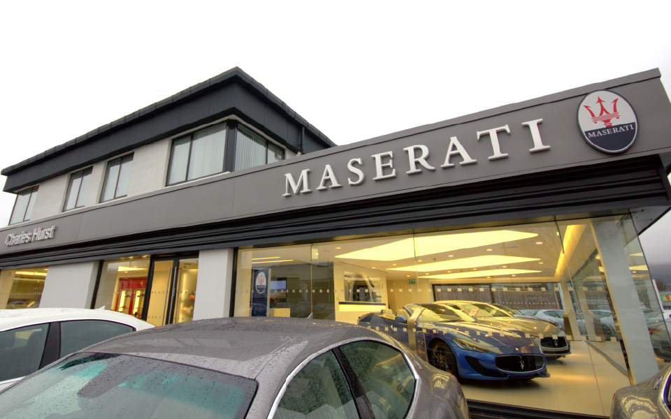 Exterior of new-build, dual-branded Ferrari and Maserati dealership and workshop in Belfast, Northern Ireland