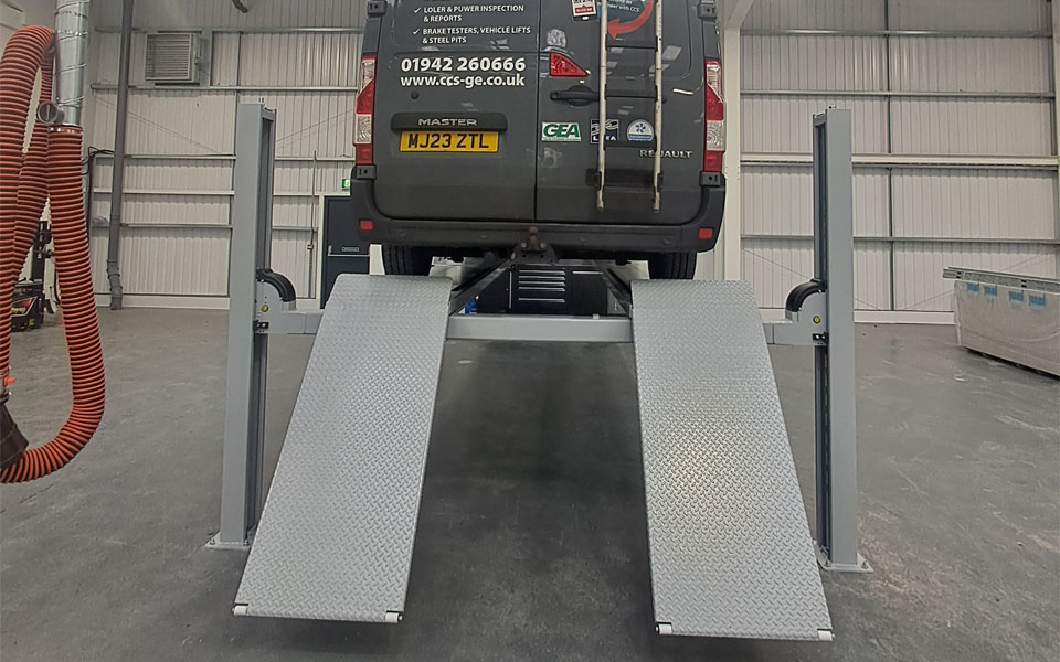 Dedicated wheel alignment bay with 4-post lift installed for Clive Suttons new workshop in north London.