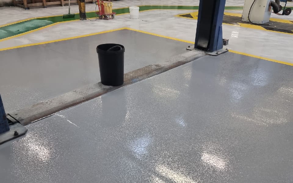 Epoxy resin floor paint with anti-slip coating installed by CCS Garage Equipment at East Midlands Airport’s vehicle maintenance workshop