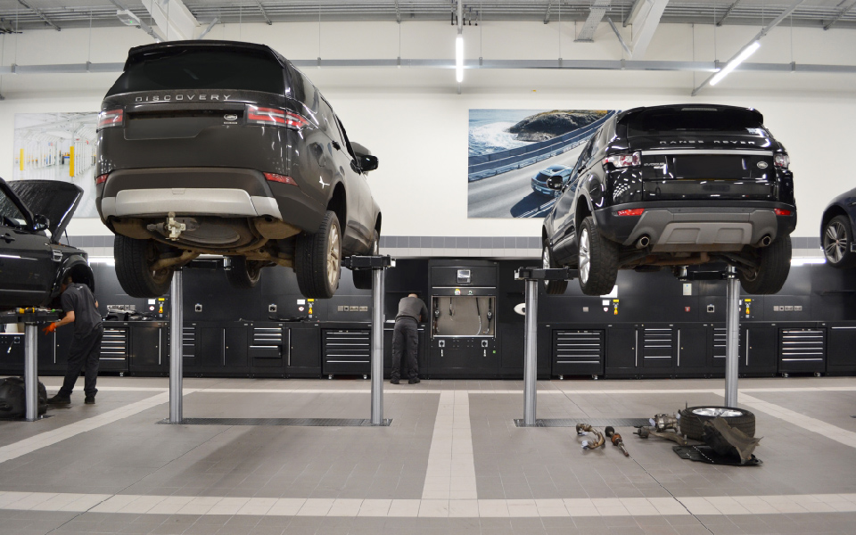 Spacious vehicle servicing bays feature 2-post in-ground hydraulic vehicle lifts installed by CCS Garage Equipment at Jaguar Land Rover, Aylesbury