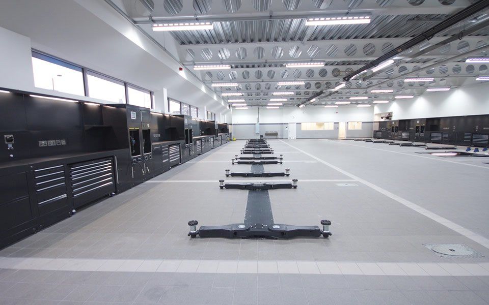 Completed installation of service bays, bespoke Dura workshop cabinets and furniture, fitted with power, data ports and lubrication reels at Jaguar Land Rover’s dealership in Battersea