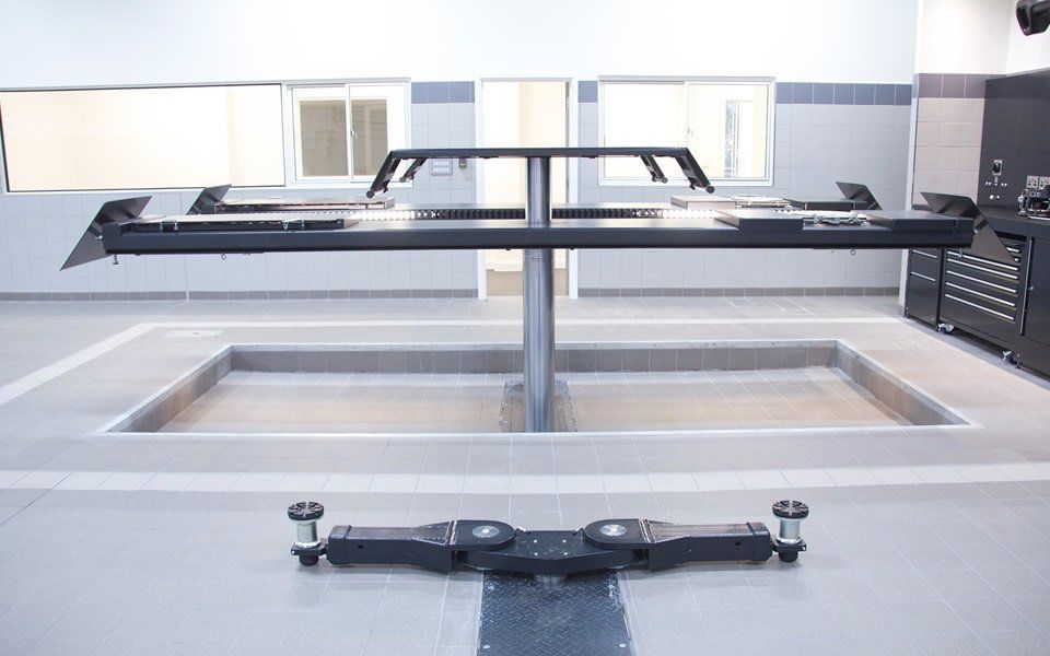 Industry-leading 2-post vehicle lifts incorporating wheel-free lifting for wheel alignment, installed by CCS Garage Equipment for Jaguar Land Rover, Battersea