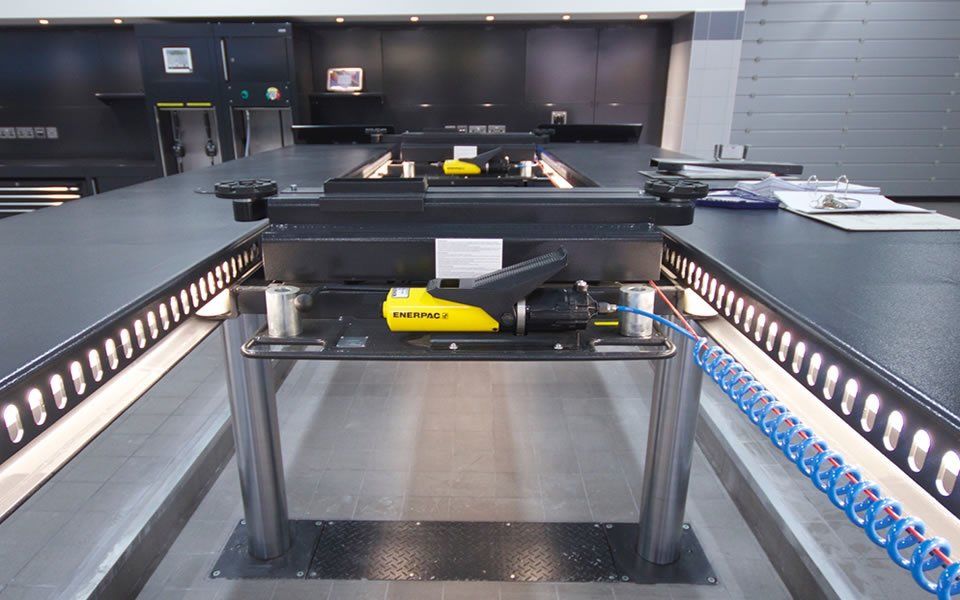 Installation of hydraulic wheeled pit jacks by CCS Garage Equipment for Jaguar Land Rover in Battersea, London