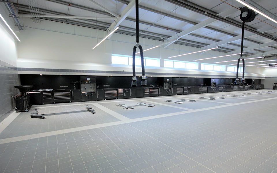 Bespoke Dura workshop furniture featuring integrated Samoa lubrication systems and ancillary equipment, installed by CCS Garage Equipment for Jaguar Land Rover, Hillington