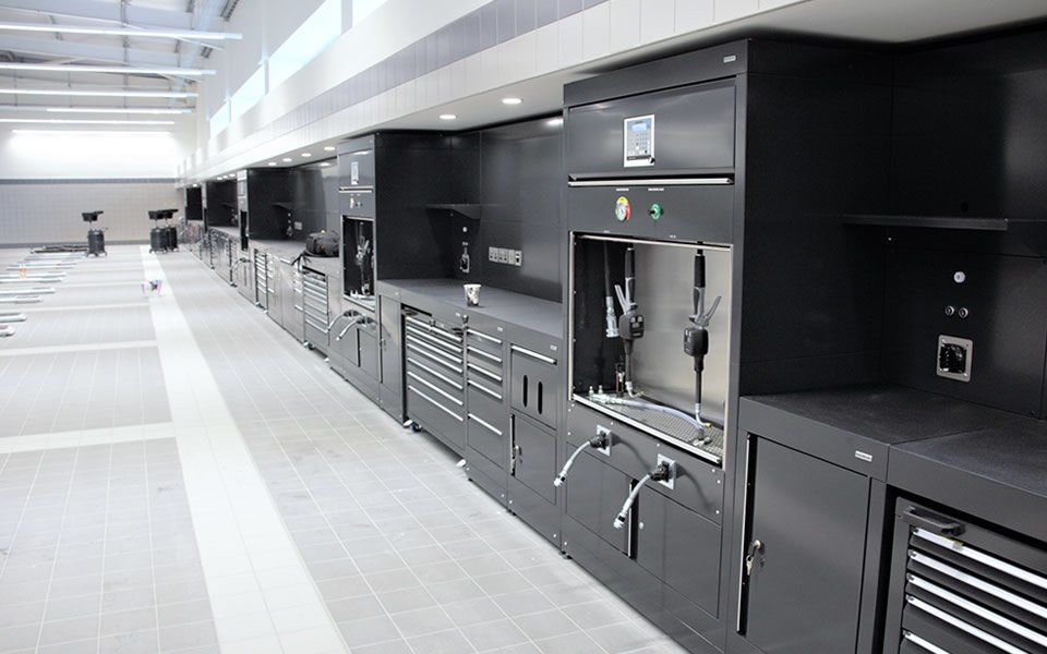 Workshop cabinets with integrated ancillary services installed by CCS Garage Equipment at Jaguar Land Rover’s dealership in Hillington, Glasgow