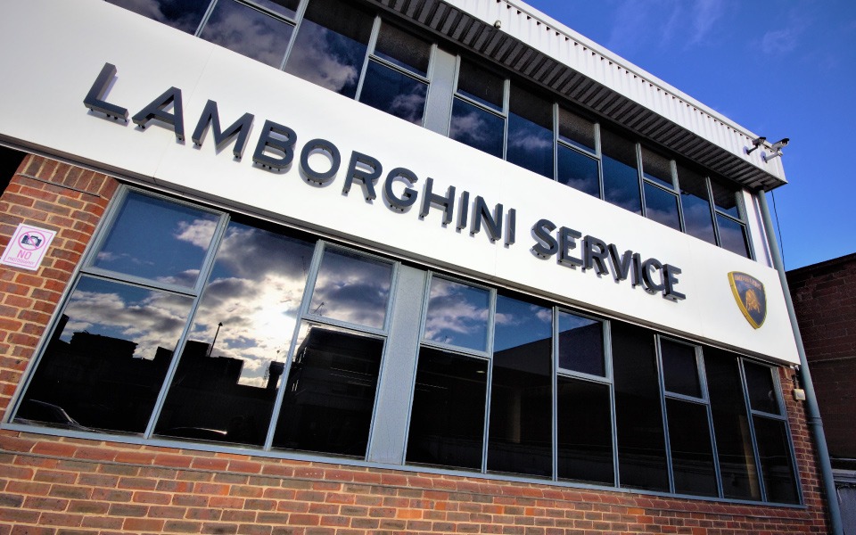 Exterior of School Road, London Lamborghini dealership’s new showroom and workshop building, with garage equipment installation designed by CCS