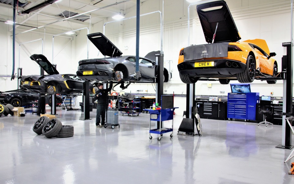 Vehicles undergoing servicing and maintenance at Lamborghini, School Road’s dealership workshop, designed and installed by CCS Garage Equipment