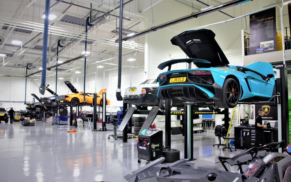 Lamborghini and Bentley servicing in fully bespoke workshop featuring garage equipment design and installation by CCS Garage Equipment