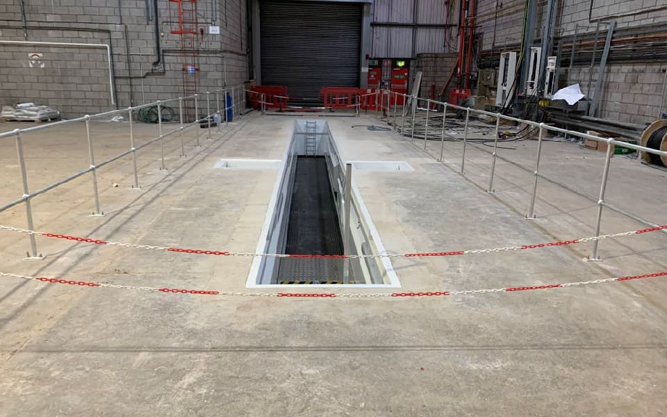 Groundworks completed prior to installation of relocated commercial brake tester in the new airport vehicle maintenance workshop 