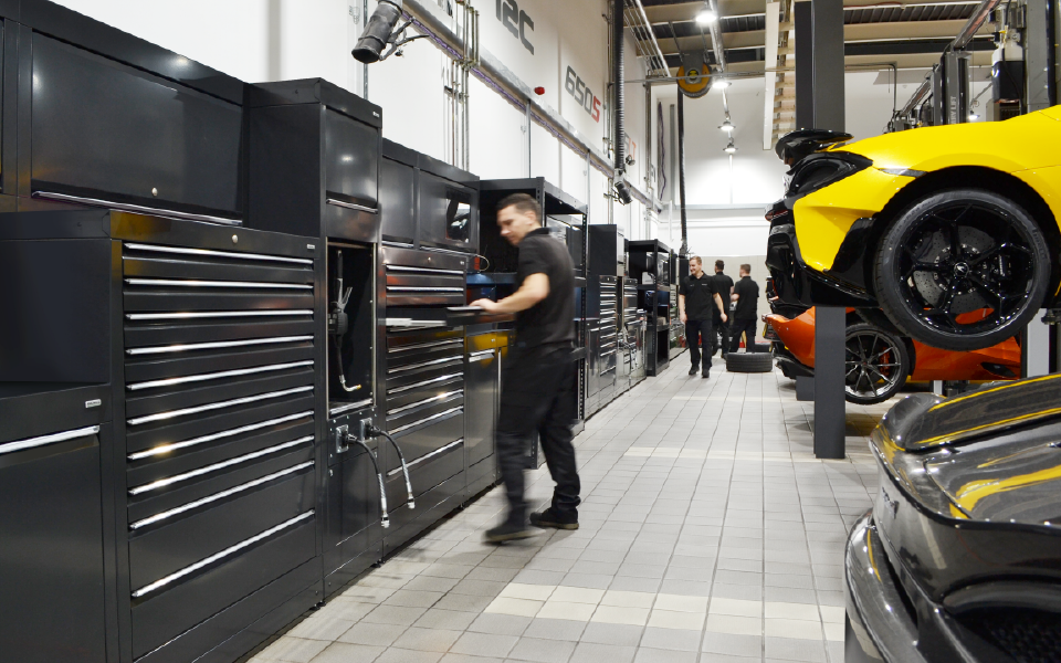 Garage equipment installation featuring bespoke Dura workshop cabinets with integrated power, data and ancillary services at McLaren’s dealership, specified by CCS Garage Equipment