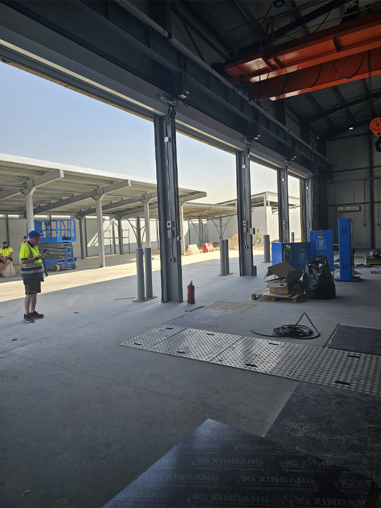 External building of new military vehicle maintenance workshop with in-ground inspection pits.