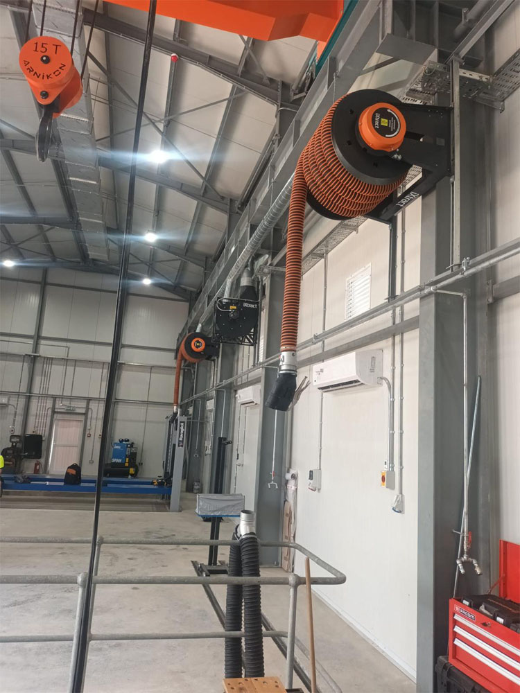 Military vehicle maintenance workshop fitted with LEV fume extraction system.