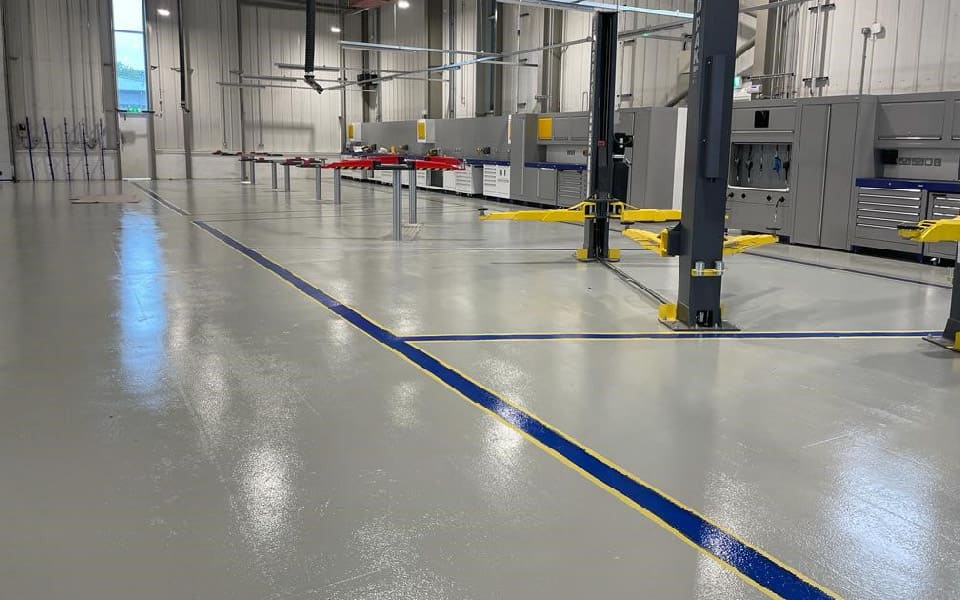 Application of resin floor paint along with safety markings