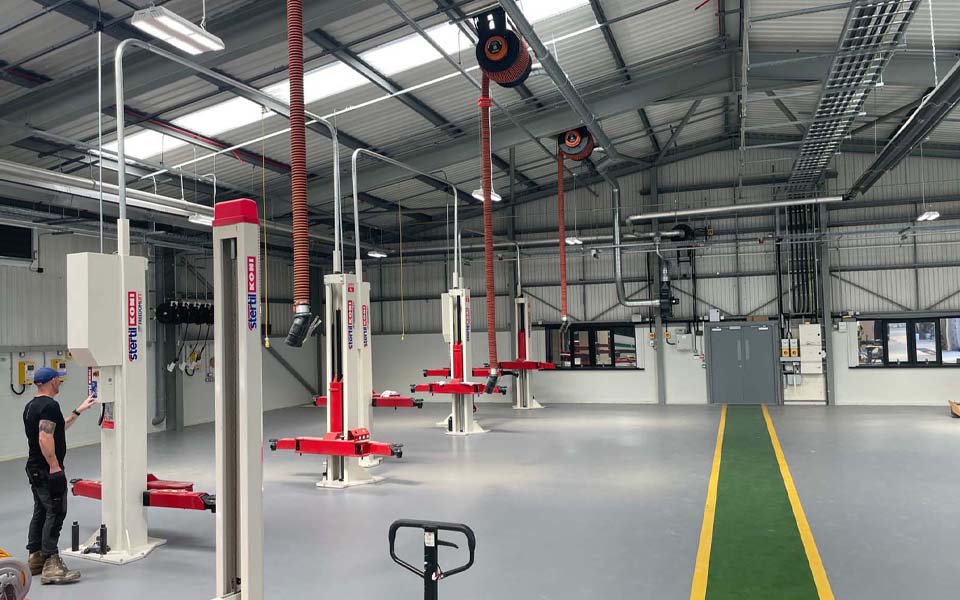CCS team member conducting final testing of machinery inside of new NWAS depot in Cumbria.