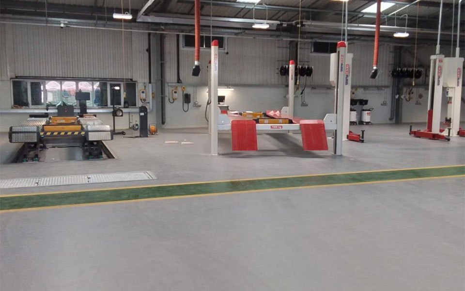 MOT bays scissor lift recessed into the ground for ease of access by all vehicles.