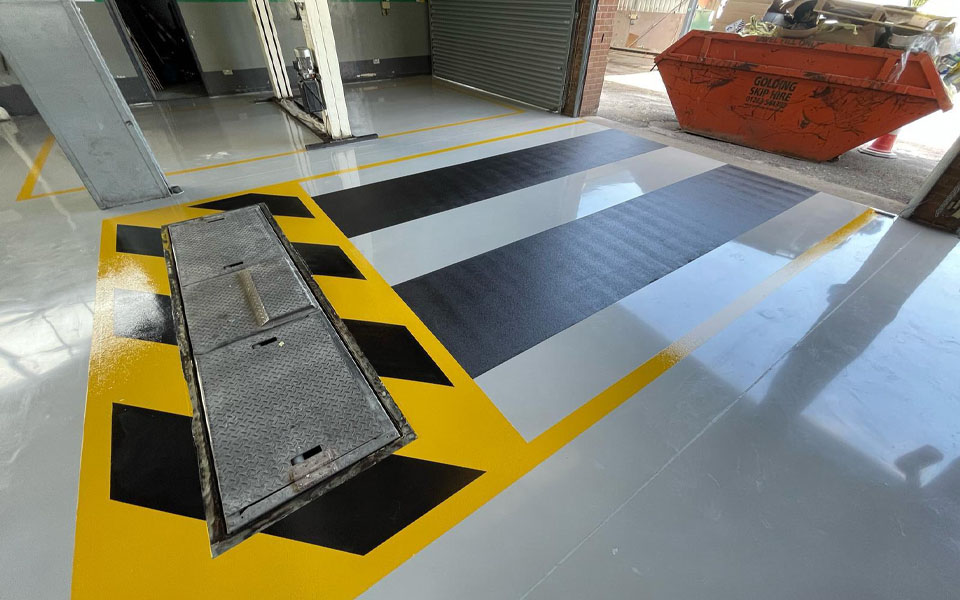 Anti-slip coating applied to vehicle drive in area installed by CCS