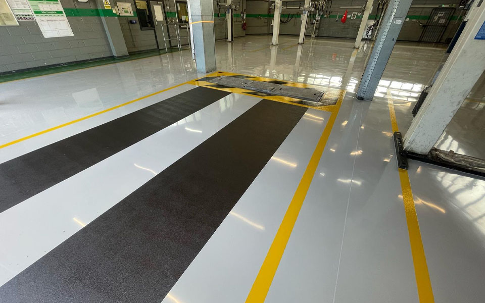 New diamond ground workshop floor applied by CCS garage equipment