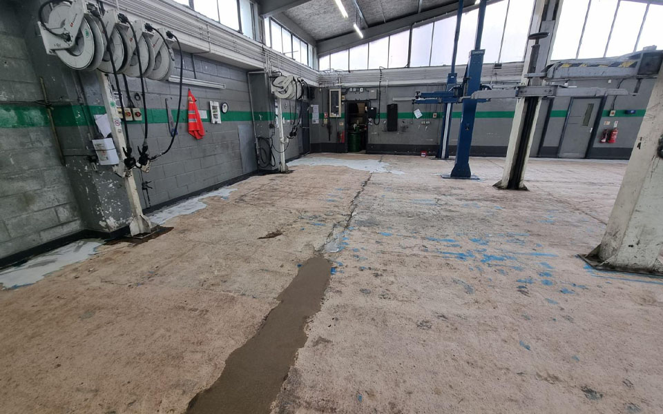 Old tired and worn workshop floor prior to CCS
