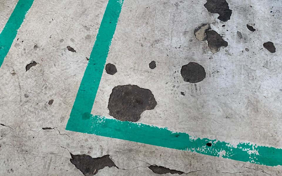 Old workshops floor with weak points showing continued deterioration