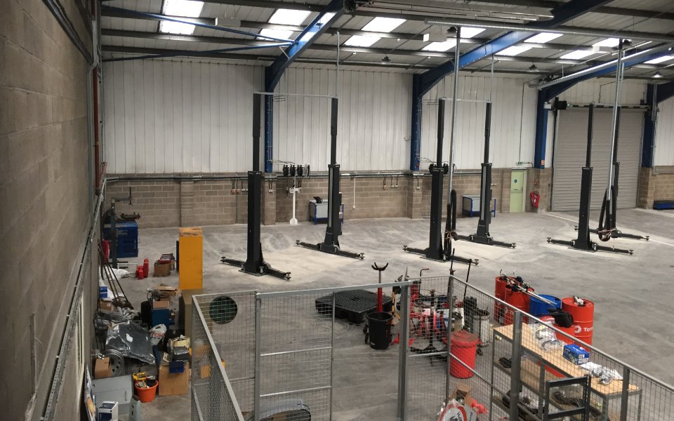 Garage equipment including new compressor, oil tanks, oil reels and stands, and an exhaust extraction system installed to Northgate, Plymouth’s commercial vehicle hire workshop’s bespoke specification by CCS Garage Equipment’s installation team