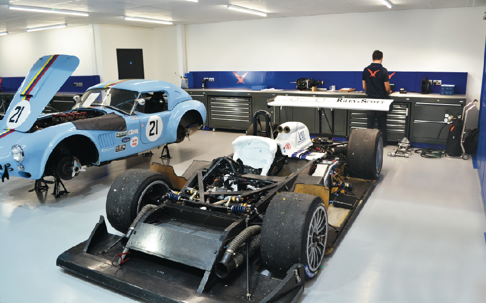 Customised workshop furniture by Dura, including mobile tool units, featuring ancillary electrical and data supply installed by CCS Garage Equipment for Pursuit Racing’s servicing and maintenance workshop in Bicester, Oxfordshire