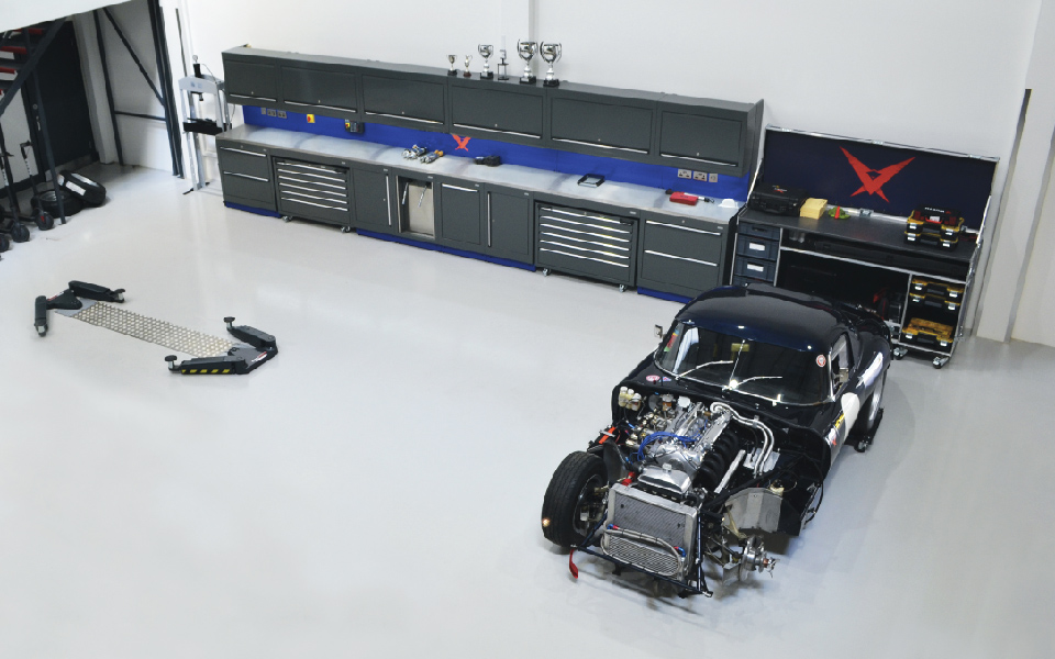 Customised workshop furniture with integrated mobile tool cabinets, and a new 2-post, in-ground vehicle lift installed at Pursuit Racing, Bicester’s servicing and maintenance workshop for motorsport vehicles by CCS Garage Equipment