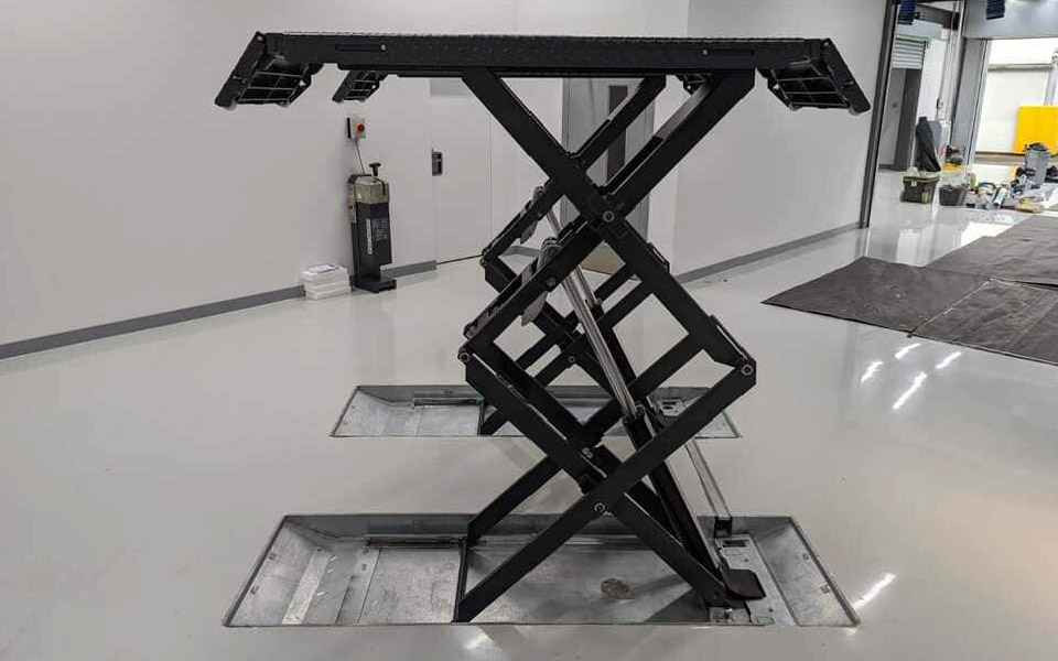 Photo features Nussbaum’s in-ground, double scissor lift vehicle installed, tested and commissioned by CCS Garage Equipment