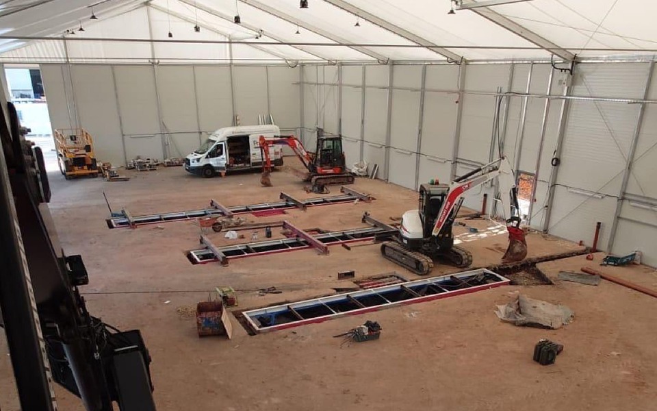 Photo shows steel inspection bit cassettes being installed in workshop