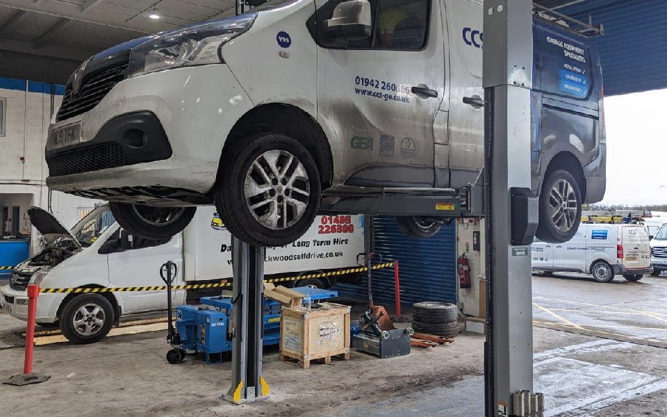 Photo shows one of our CCS vans being used in testing of this fixed 2-post vehicle lift