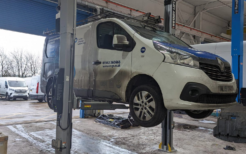 Photo shows installation, testing & commissioning of fixed 2-post commercial vehicle lift managed by CCS’ South Wales garage equipment installation engineers