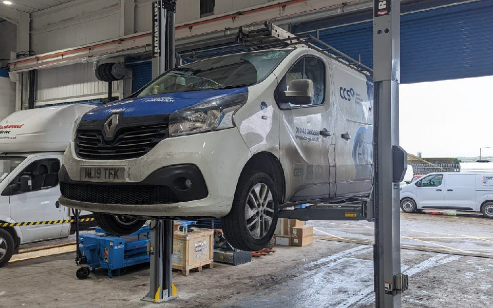 Photo shows our team thoroughly testing & commissioning the new 2-post vehicle lift for VMS Vehicle Hire