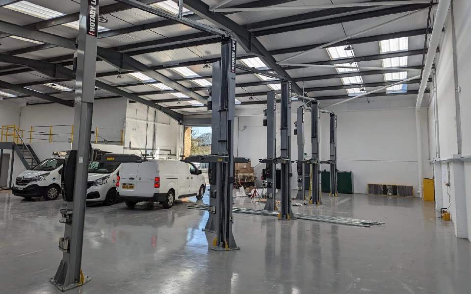 Photo shows completed vehicle installation of 4x 5.5T, 2-post vehicle lifts