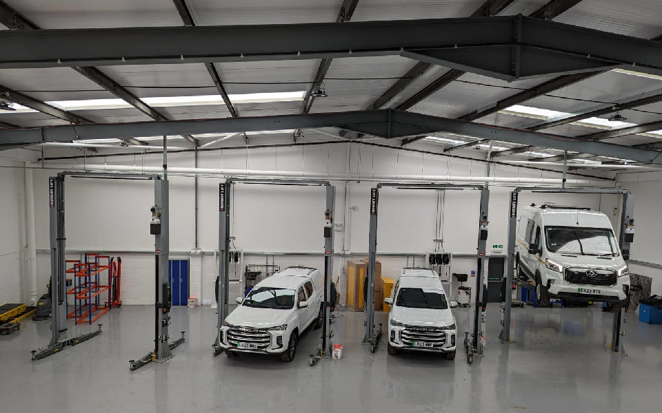 Photo shows VMS Vehicle Hire Stevenage’s spacious commercial workshop in operation