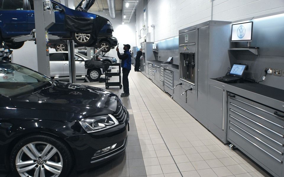 Bespoke Dura workshop furniture featuring small tool storage and integrated power and data ports, specified and supplied by CCS Garage Equipment for Volkswagen, Battersea