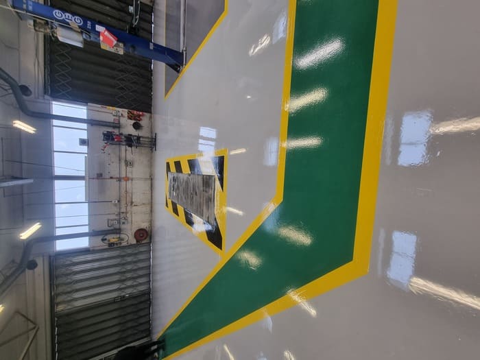 Photo showing newly repainted Garage Workshop floor surface
