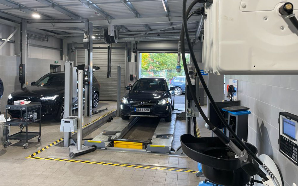 Vehicle servicing and maintenance underway in Volvo Shrewsburys new dealership workshop service bay equipped with a fixed 4-post lift by CCS