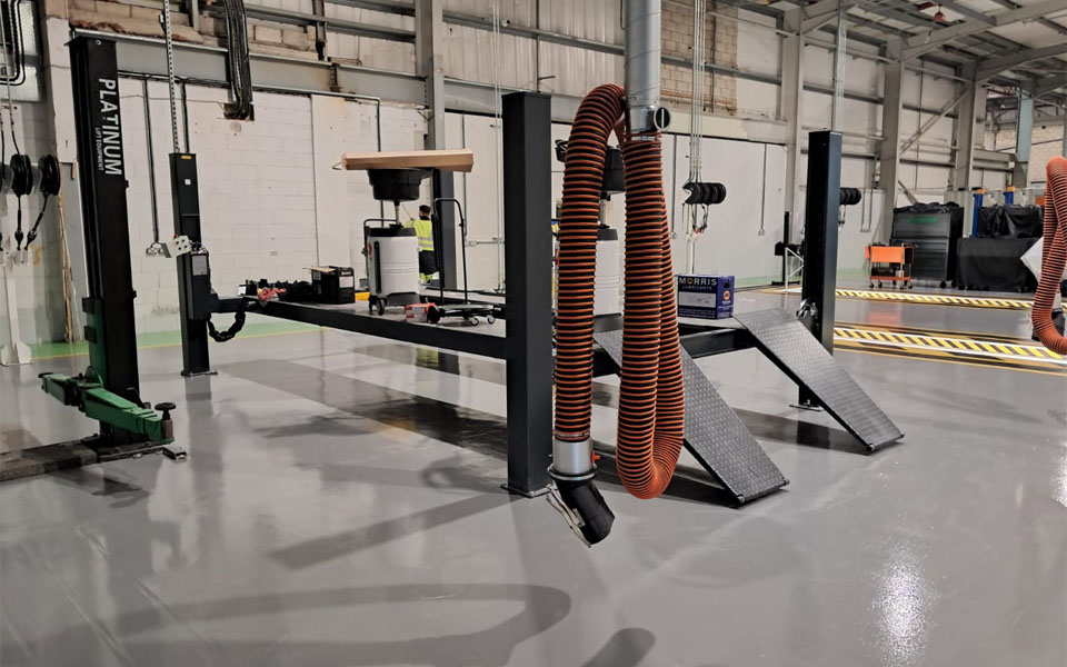 LEV exhaust fume extraction system fitted to all servicing areas inside of new commercial vehicle workshop for Lanes Group.