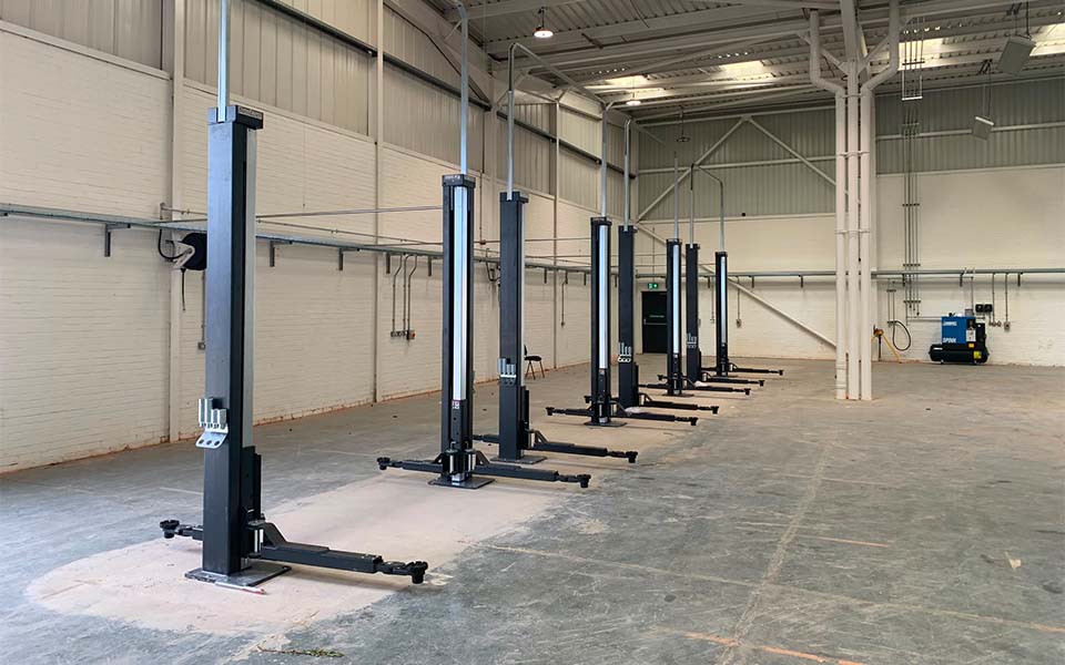 Nussbaum Smart Lifts installed by CCS Garage Equipment onto reinforced floor pads.