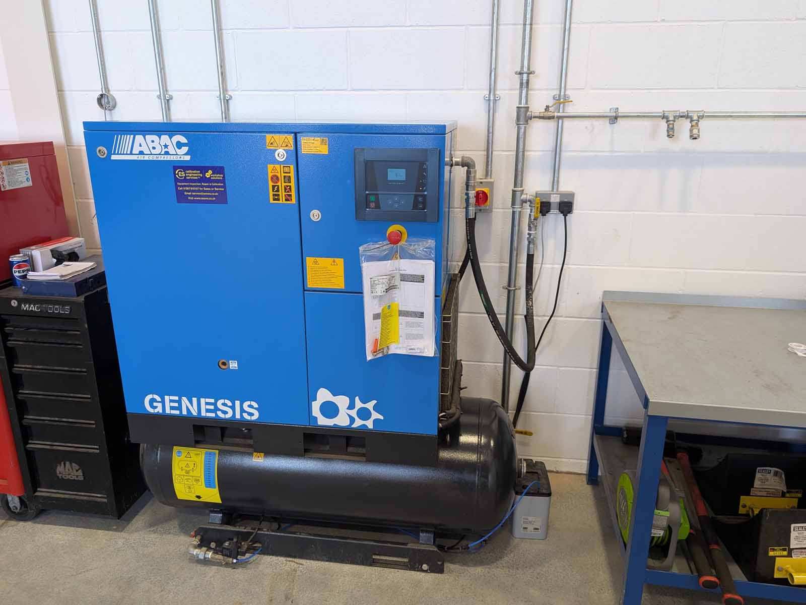 Air compressor installed within new Specialist Fleet Services workshop servicing each vehicle maintenance bay.
