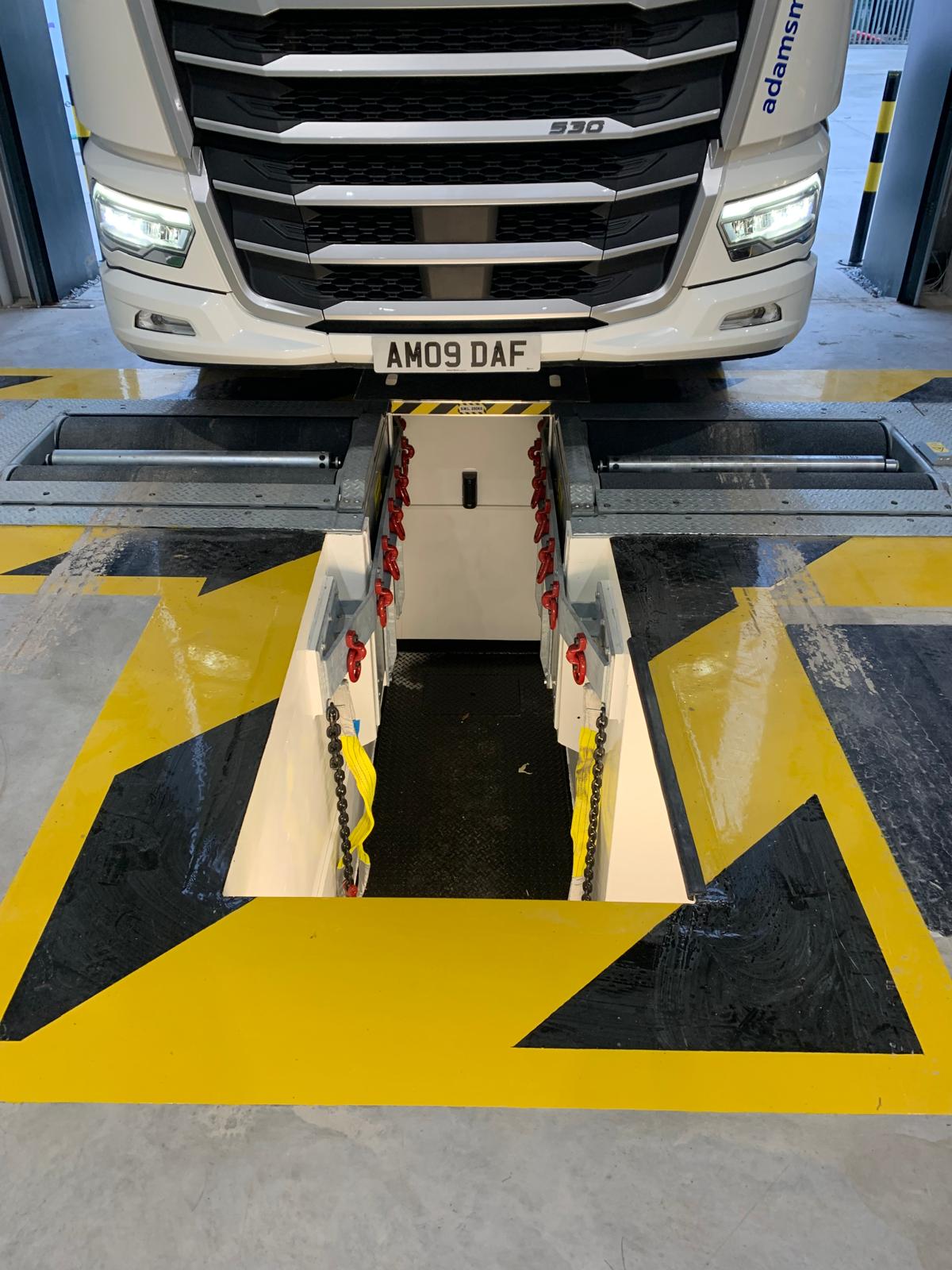 Simulated load commercial break tester for Adams Morey Bridgewater featuring yellow floor safety markings.