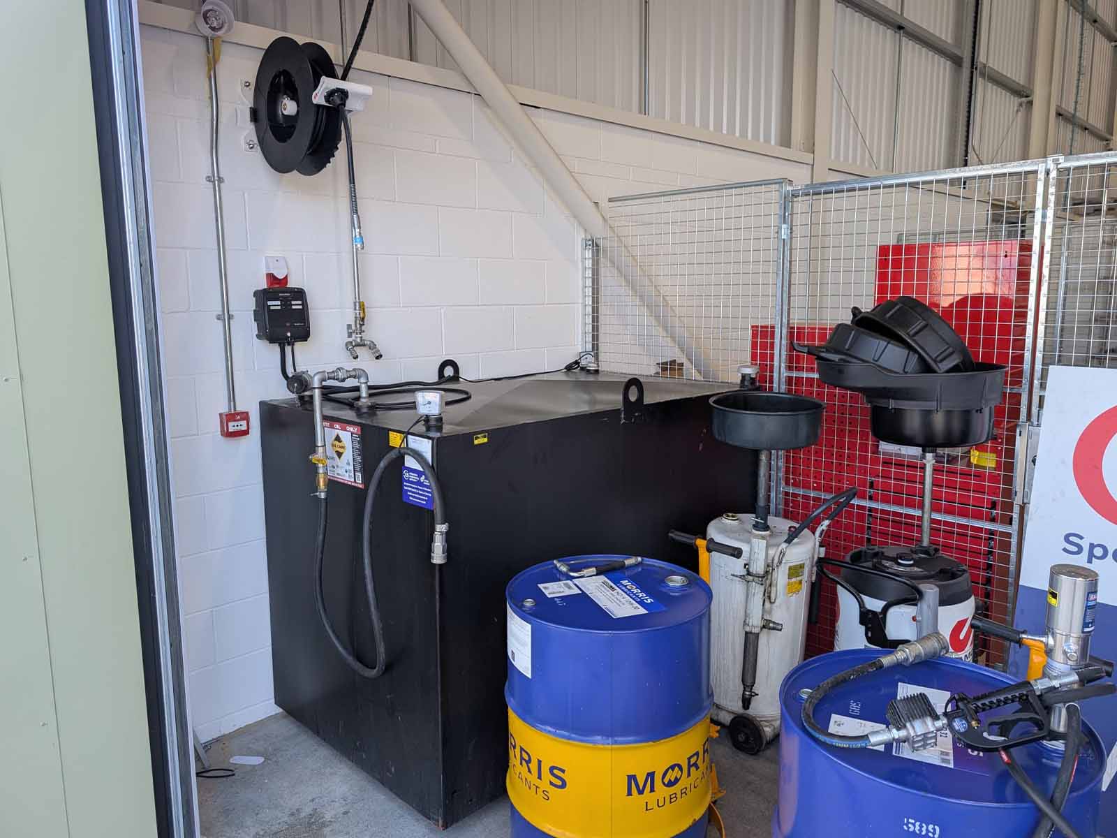 Waste oil tank and waste collection units relocated by CCS Garage Equipment.
